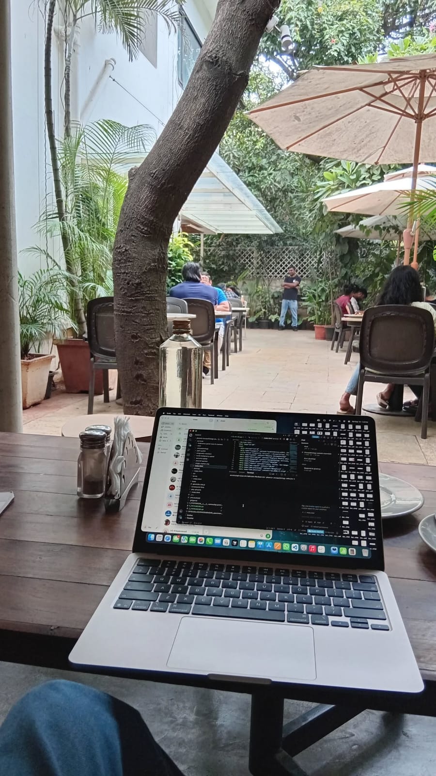 Laptop with code open at a cafe